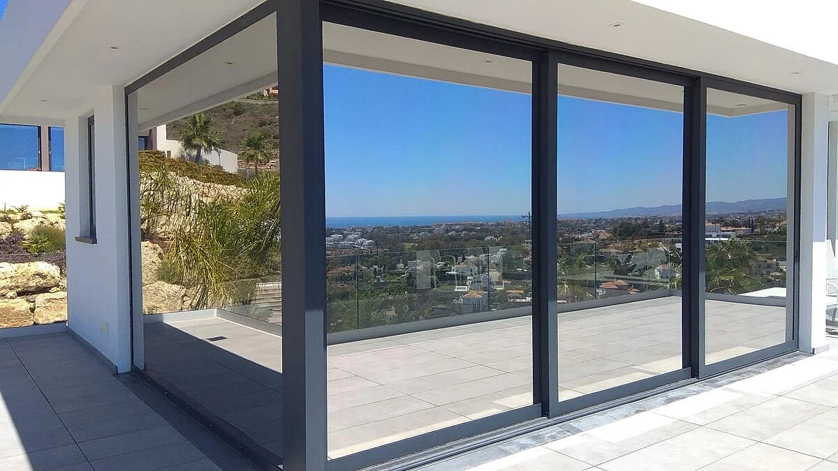 One-way reflective window film on panoramic sliding doors in a Benahavís villa