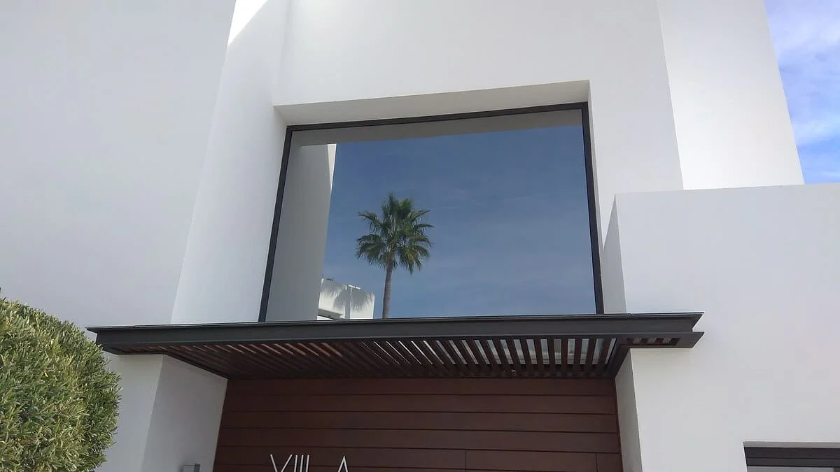 Reflective solar window film on a modern villa in Málaga